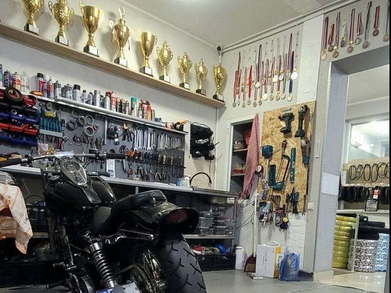 Racing trophies and medals above the bench