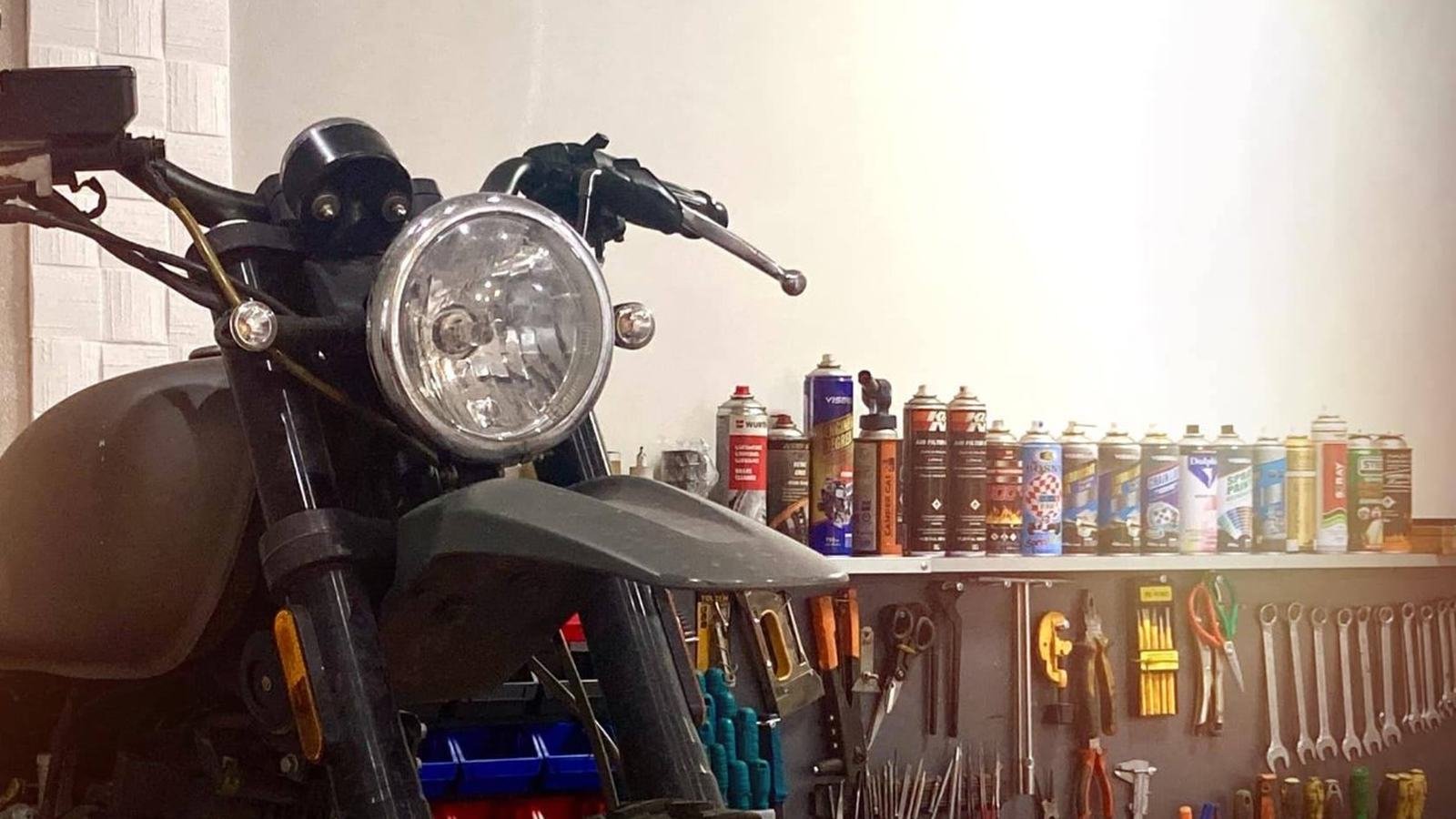 Workshop tool wall with wrenches, pliers and service sprays