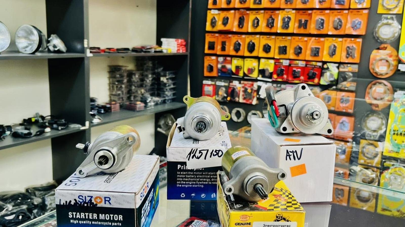 Motorcycle and ATV starter motors on the counter