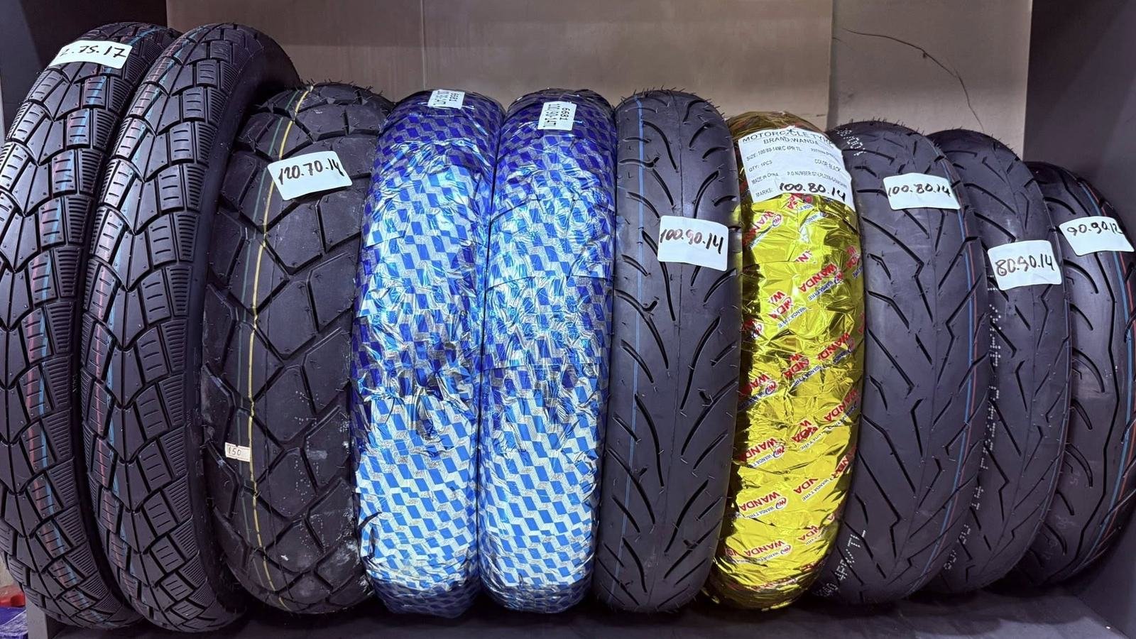 Motorcycle tyres in stock, labelled by size